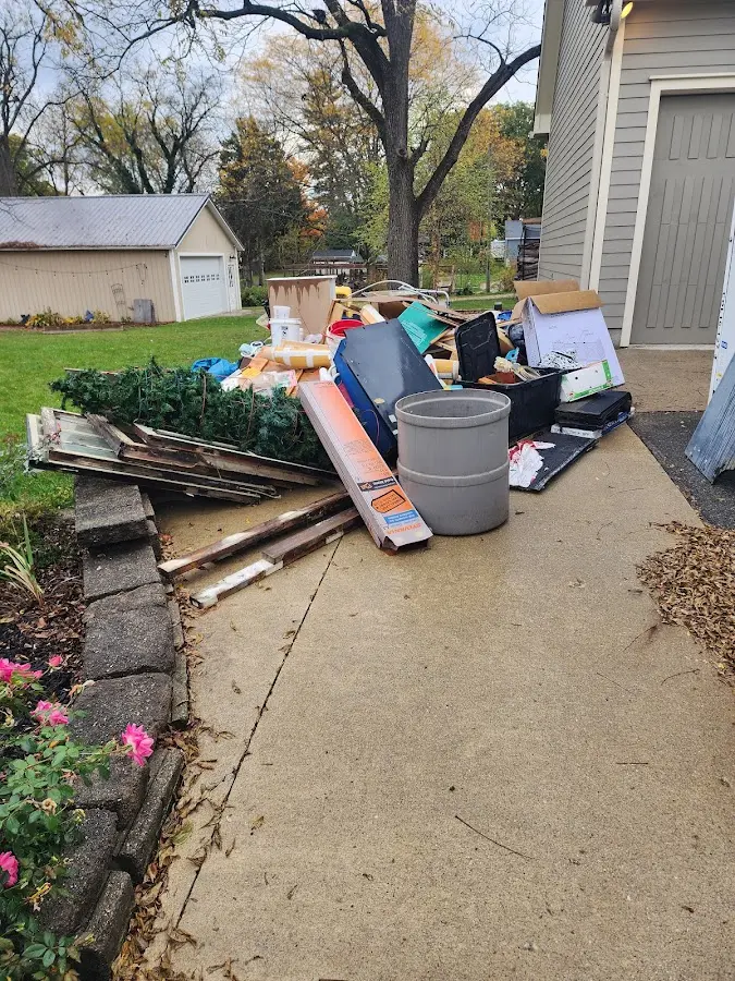 Dumpster being loaded with debris for Residential Dumpster Rental in Beebe